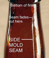 Close-up of the side mold seam on a molded & tooled finish bottle; click to enlarge.