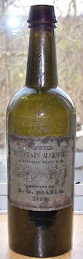 Labeled liquor bottle from 1850; click to enlarge.