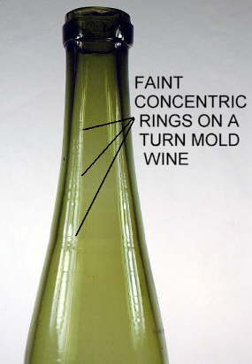 Turn-mold bottle showing faint concentric rings on the body.